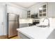 Well-lit kitchen features stainless appliances, white countertops, and white cabinets at 430 Lindbergh Ne Dr # M1, Atlanta, GA 30305