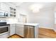 Bright kitchen with stainless steel appliances, white cabinets, and hardwood floors at 430 Lindbergh Ne Dr # M1, Atlanta, GA 30305