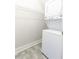 Efficient stacked washer and dryer unit, complemented by functional wire shelving at 430 Lindbergh Ne Dr # M1, Atlanta, GA 30305