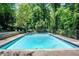 Refreshing community swimming pool with clear blue water and ample space for recreation at 430 Lindbergh Ne Dr # M1, Atlanta, GA 30305