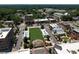 Aerial view of community with apartments, and houses surrounded by lush green trees and sidewalks at 110 Chiswick Cir # 40, Alpharetta, GA 30009