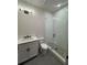Modern bathroom with a glass-enclosed shower, neutral walls, modern lighting, and a vanity with a sink at 110 Chiswick Cir # 40, Alpharetta, GA 30009