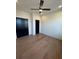 Bedroom with wood floors, dark doors and ceiling fan at 110 Chiswick Cir # 40, Alpharetta, GA 30009