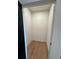 Small closet space with wood floors and white trim and walls at 110 Chiswick Cir # 40, Alpharetta, GA 30009