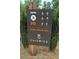 Chiswick community health and wellness trail and fitness sign on wooden post, surrounded by landscaping at 110 Chiswick Cir # 40, Alpharetta, GA 30009