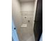 Convenient laundry room with tile flooring and washer/dryer hookups, plus one storage shelf at 110 Chiswick Cir # 40, Alpharetta, GA 30009