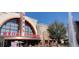 Exterior of Regal Cinema building with the red sign, fountain and trees at 110 Chiswick Cir # 40, Alpharetta, GA 30009