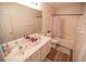 Bright bathroom featuring a double sink vanity and shower-tub combo with a curtain at 849 Kirsten Jane Ct, Lawrenceville, GA 30045