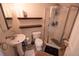 Bathroom featuring shower, toilet, sink, and neutral-colored tiles, creating a functional space at 849 Kirsten Jane Ct, Lawrenceville, GA 30045