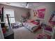 The bedroom is uniquely decorated and is filled with toys and colorful decor at 849 Kirsten Jane Ct, Lawrenceville, GA 30045