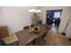 Dining area with a large dining table with seating for six, a chandelier and ample lighting at 849 Kirsten Jane Ct, Lawrenceville, GA 30045