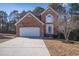 Charming brick two-story home with attached garage and well-manicured front lawn at 849 Kirsten Jane Ct, Lawrenceville, GA 30045