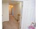 Bright hallway featuring carpeted floors, neutral walls, and white trim, leading to multiple rooms at 849 Kirsten Jane Ct, Lawrenceville, GA 30045