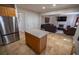 Spacious kitchen with an island and stainless steel appliances offering a seamless transition to the living area at 849 Kirsten Jane Ct, Lawrenceville, GA 30045