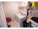 Functional laundry room with washer, dryer, and shelving for storage at 849 Kirsten Jane Ct, Lawrenceville, GA 30045
