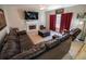 Inviting living room with a fireplace and large windows that offer ample natural light at 849 Kirsten Jane Ct, Lawrenceville, GA 30045