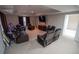 This living room features carpet floors, furniture, curtains, and a television at 849 Kirsten Jane Ct, Lawrenceville, GA 30045