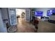 Bright office with double french doors, tiled floor, and includes a large desk with a dual monitor setup at 849 Kirsten Jane Ct, Lawrenceville, GA 30045