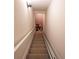Carpeted staircase equipped with a stair lift for easy access to the lower level at 849 Kirsten Jane Ct, Lawrenceville, GA 30045