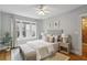 Serene bedroom featuring hardwood floors, natural light, and stylish decor at 272 14Th Ne St # 18, Atlanta, GA 30309