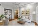 Bright living room with hardwood floors, modern track lighting and stylish furniture at 272 14Th Ne St # 18, Atlanta, GA 30309