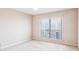 A carpeted bedroom with a window and ceiling fan at 310 Comeragh Se, Smyrna, GA 30080