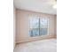 A carpeted bedroom with a ceiling fan and window at 310 Comeragh Se, Smyrna, GA 30080