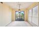 Bright dining area with natural light, a modern light fixture, and a balcony view at 310 Comeragh Se, Smyrna, GA 30080