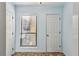 Cozy entryway with blue walls, tiled floor, and natural light from window with blinds at 310 Comeragh Se, Smyrna, GA 30080