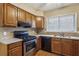 Kitchen featuring wooden cabinets and stainless steel appliances at 310 Comeragh Se, Smyrna, GA 30080