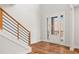 Stylish entryway featuring hardwood floors, modern staircase, and front door with sidelights at 3474 Dryden Se Ln, Vinings, GA 30339