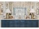 Chic bar area featuring navy blue cabinetry, marble countertop, and mirrored backsplash at 675 W Paces Ferry Nw Rd, Atlanta, GA 30327