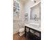 Charming half bath featuring a modern sink, marble countertop, and wood flooring at 675 W Paces Ferry Nw Rd, Atlanta, GA 30327