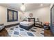 Charming bedroom with a blue trim and a cozy sitting area is lit by a unique spherical ceiling light at 675 W Paces Ferry Nw Rd, Atlanta, GA 30327