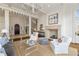 Elegant living room with a stone fireplace, spiral staircase, and stylish furnishings at 675 W Paces Ferry Nw Rd, Atlanta, GA 30327