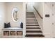 Elegant staircase features wood treads, a stylish window nook, and convenient built-in storage at 675 W Paces Ferry Nw Rd, Atlanta, GA 30327