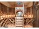 Spacious wine cellar showcasing custom wood racking and ambient lighting for optimal storage at 675 W Paces Ferry Nw Rd, Atlanta, GA 30327