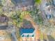 An aerial view of a residential property showing the roof and surrounding landscape at 6884 Robinson St, Lithonia, GA 30058