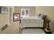 A bedroom with a vintage full-length mirror and a window with bright natural light at 6884 Robinson St, Lithonia, GA 30058