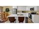 Modern kitchen featuring stainless steel appliances and a bright quartz countertop island with barstool seating at 6884 Robinson St, Lithonia, GA 30058