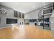 Open concept living room with hardwood floors, spiral staircase, and blue kitchen cabinets at 1300 Indian Nw Trl, Atlanta, GA 30327