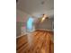 Spacious bedroom with hardwood floors, gray walls, and a ceiling fan at 180 S Alexander St, Buford, GA 30518