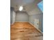 Bedroom featuring wood floors and a door to the hallway at 180 S Alexander St, Buford, GA 30518