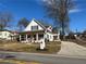 Lovely home with a welcoming front porch and a beautifully landscaped yard at 180 S Alexander St, Buford, GA 30518