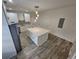 Bright kitchen featuring an island with a white countertop and modern lighting at 180 S Alexander St, Buford, GA 30518