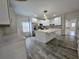 Modern kitchen with white cabinets, stainless steel appliances, and a large center island at 180 S Alexander St, Buford, GA 30518