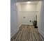 Functional laundry room space with wood-look floors and ample room for storage at 180 S Alexander St, Buford, GA 30518