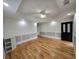 Bright and airy living room with hardwood floors, recessed lights, and elegant wall trim at 180 S Alexander St, Buford, GA 30518