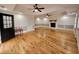 Large living room with hardwood flooring, featuring a fireplace and great natural light at 180 S Alexander St, Buford, GA 30518