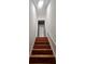Interior view of wooden stairs leading up at 180 S Alexander St, Buford, GA 30518